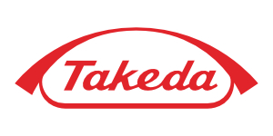 El logotipo de Takeda muestra el nombre de la empresa en letras rojas, subrayado por un arco rojo curvado, sobre un fondo blanco.
